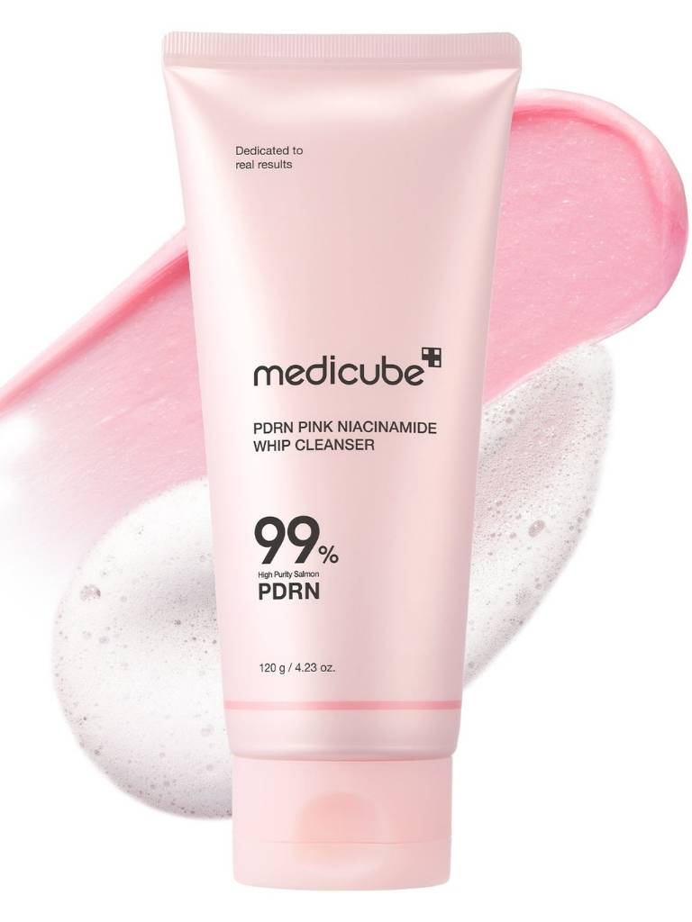 Pink tube of Medicube cleanser with a pink background