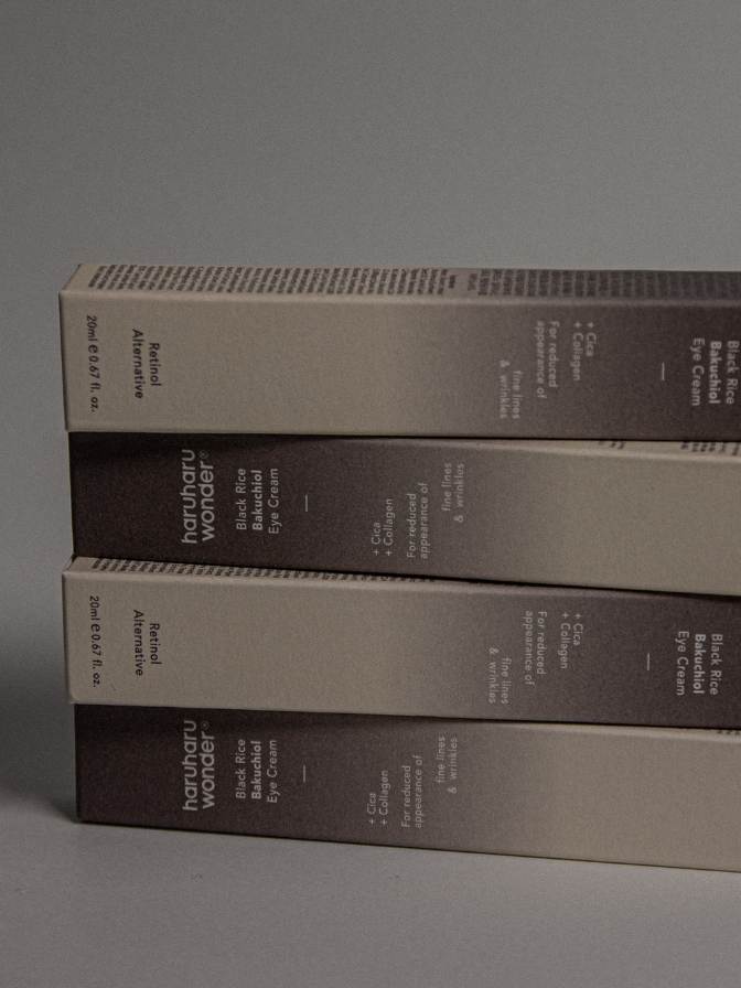 Stack of books with a gradient color scheme on a gray background