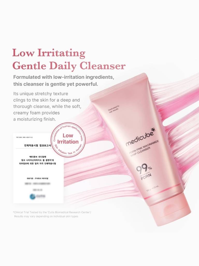Pink cleanser bottle with text about low irritation and gentle daily cleansing on a white background
