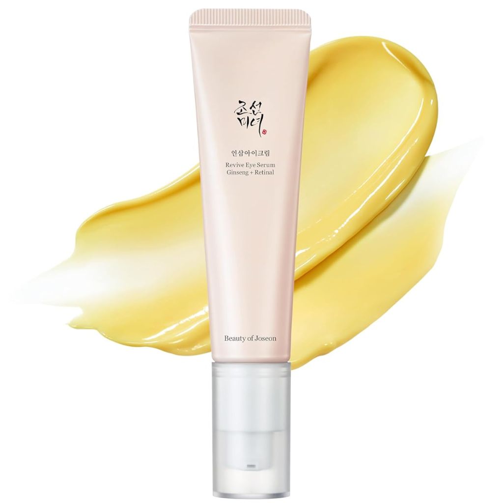 Beauty of Joseon Revive Eye Skincare tube with yellow cream smear on a white background