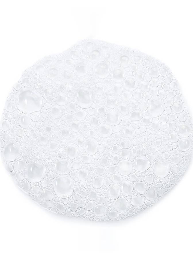 Round white object with a textured surface on a white background